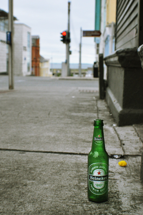 Heineken bottle on a sidewalk in Ireland