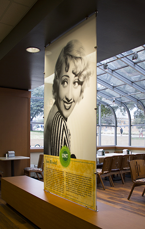 8 foot tall acrylic screen featuring Joan Blondell's photo and bio.